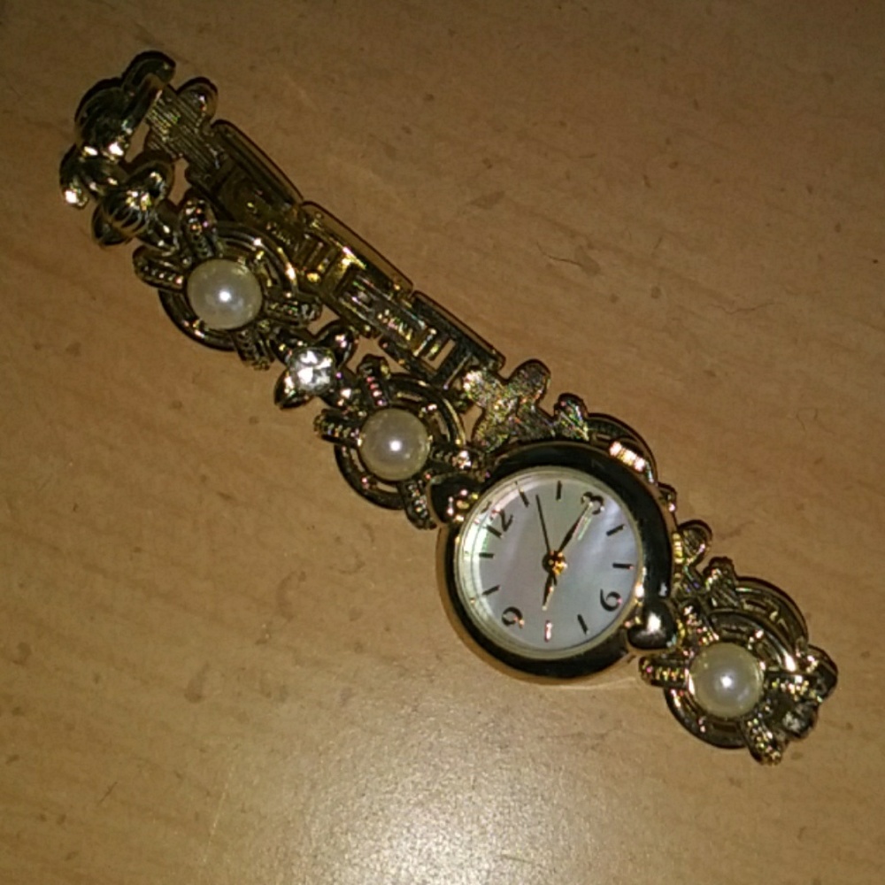 Gold and pearl watch